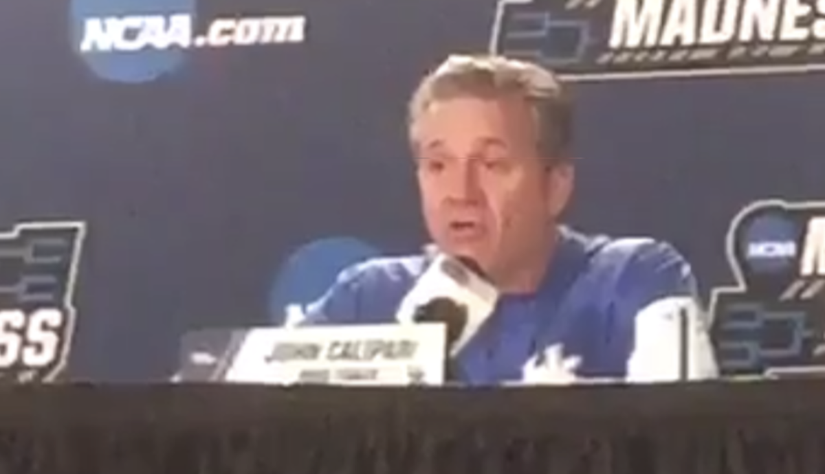 Coach Cal addresses the media.