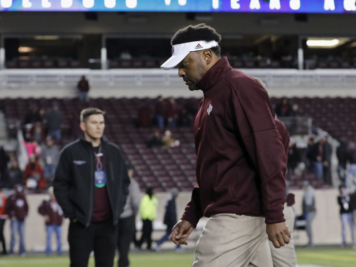 A closeup of Kevin Sumlin walking off the field.