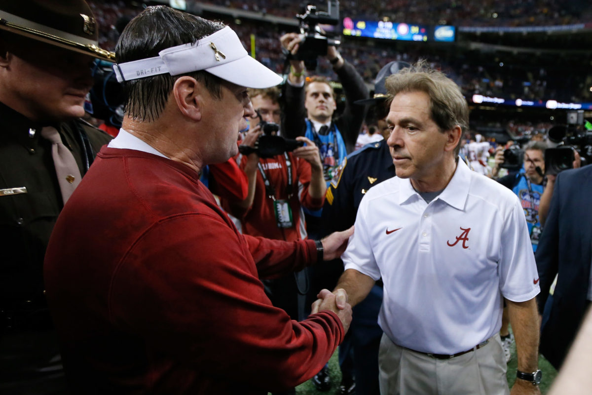 Head coach Bob Stoops of the Oklahoma Sooners is congratulated by Nick Saban, head coach of the Alabama Crimson Tide during the Allstate Sugar Bowl.