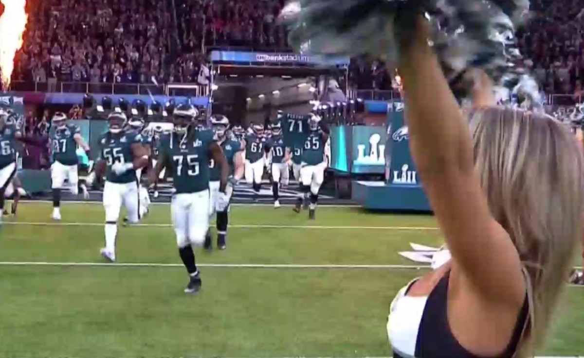 Eagles players run out of the tunnel.