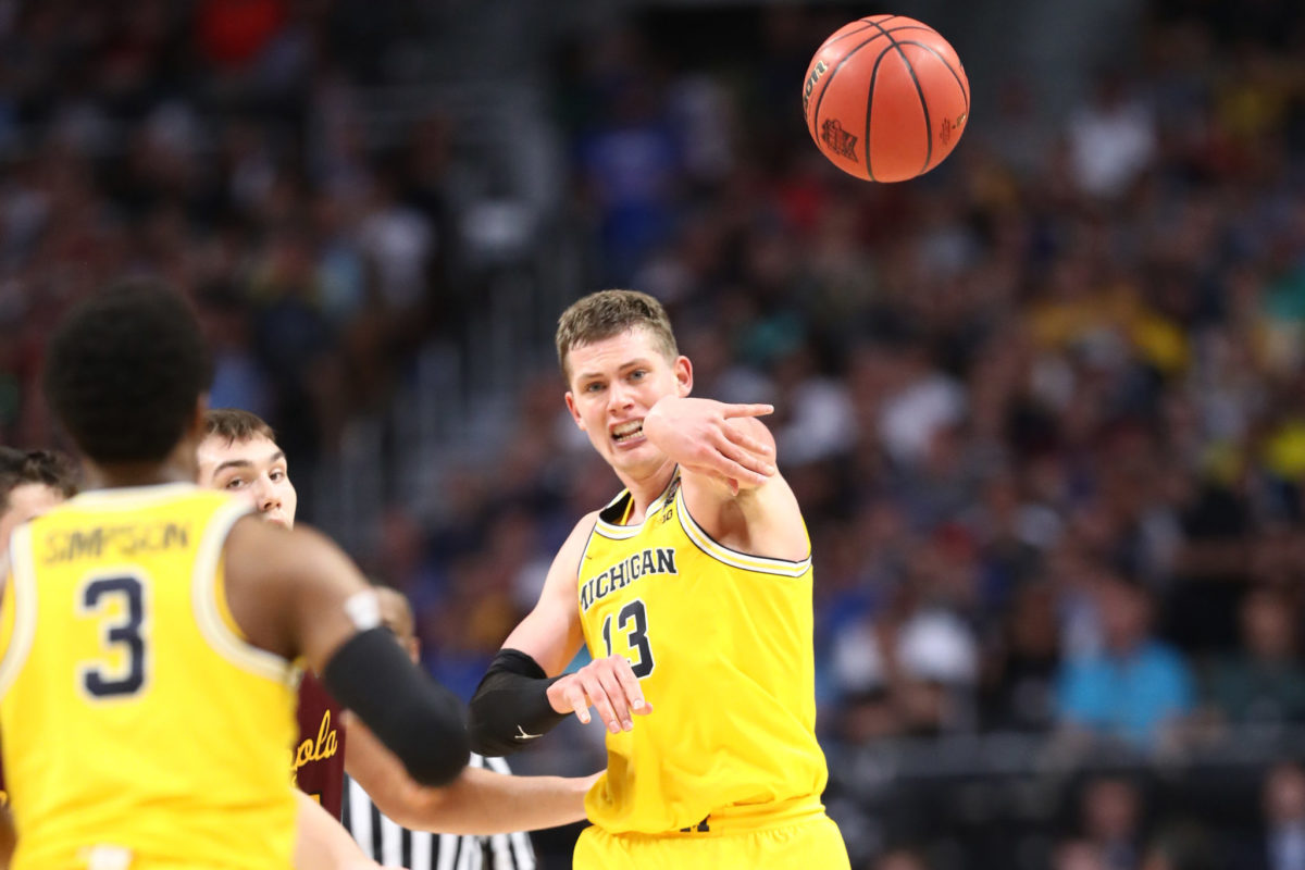 Moritz Wagner of the Michigan Wolverines attempts to pass against the Loyola Ramblers in the second half during the 2018 NCAA Men's Final Four Semifinal.