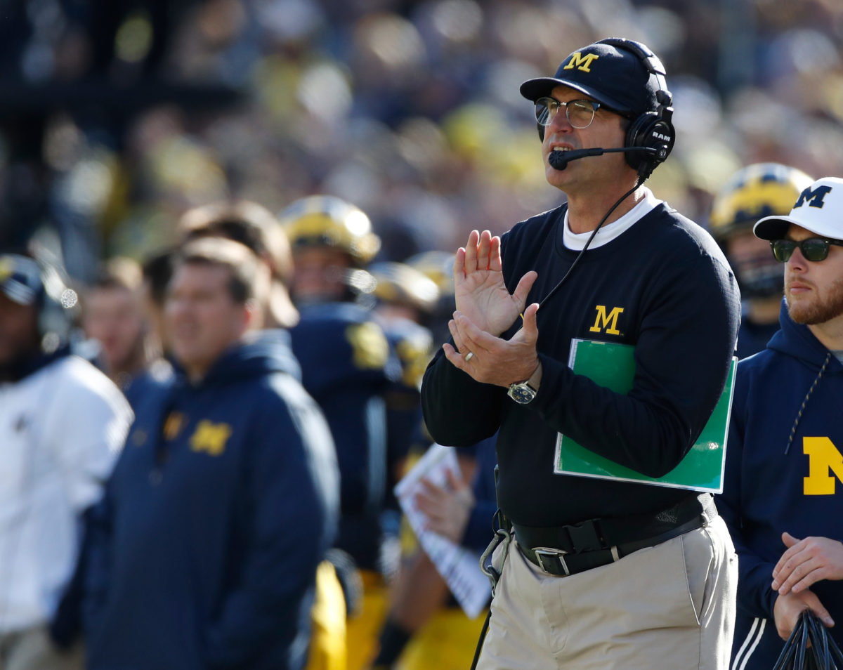 Head coach Jim Harbaugh looks on while playing the Illinois Fighting Illini on October 22, 2016 at Michigan Stadium in Ann Arbor, Michigan.