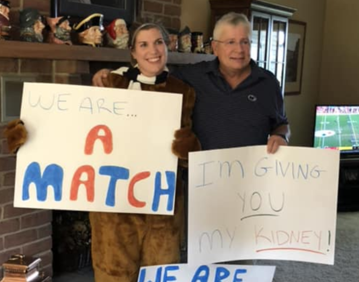 Lindsay Wenrich surprises Penn State fan with signs.