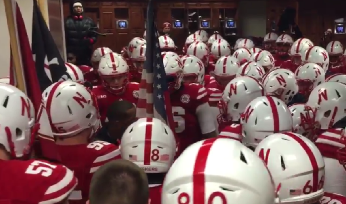 Players surround Ameer Abdullah in the locker room before game against Iowa.
