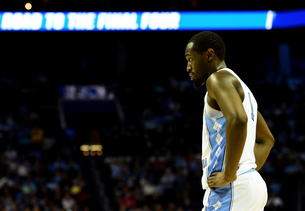 Theo Pinson standing with his hands on his waste.