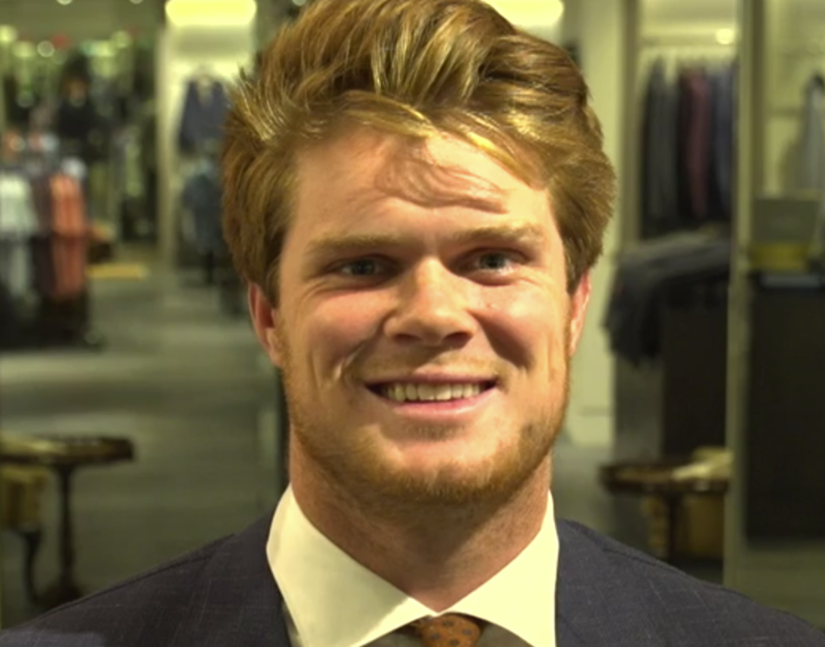 Sam Darnold wears a brown tie ahead of the NFL Draft.