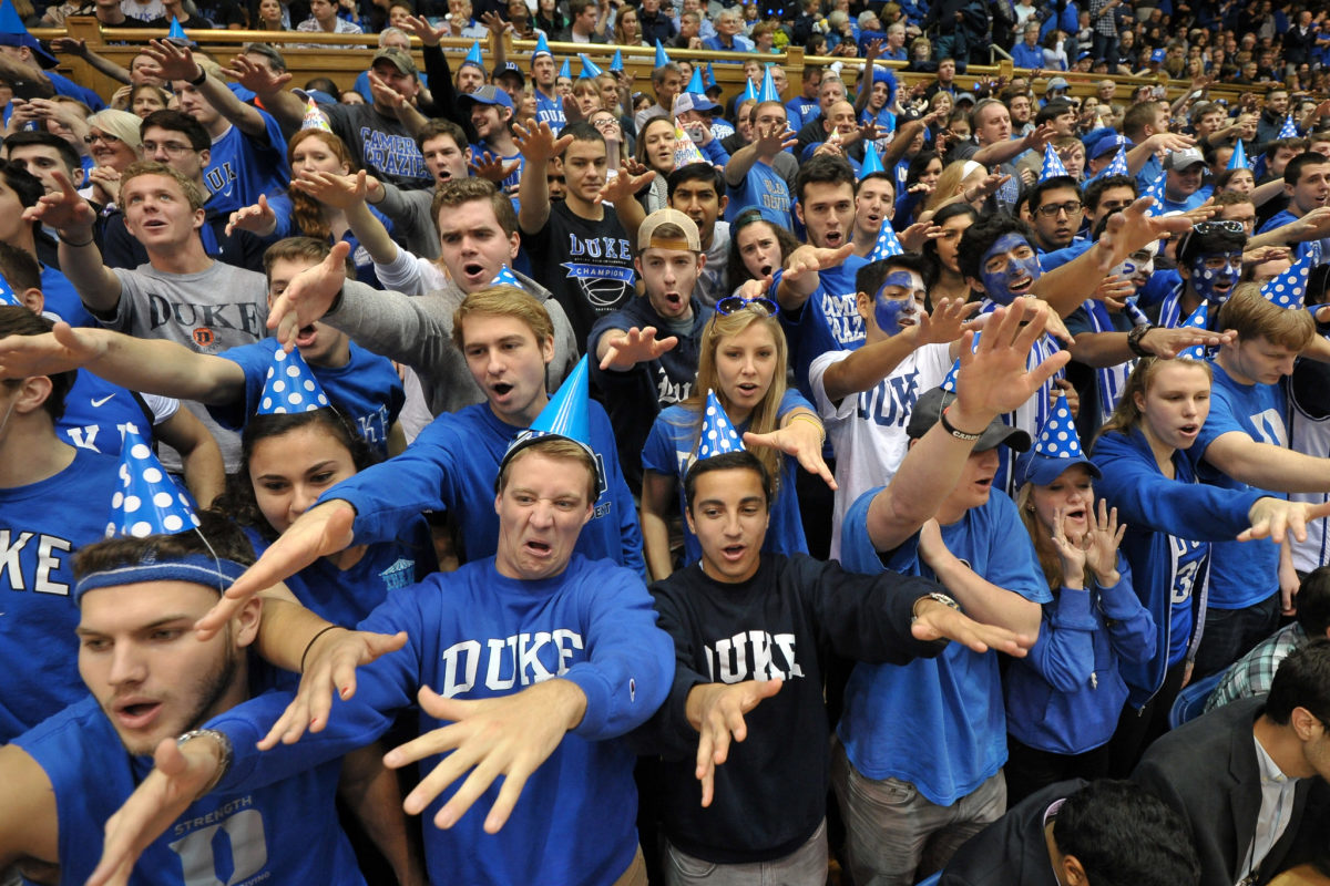 Duke fans cheer on their team.