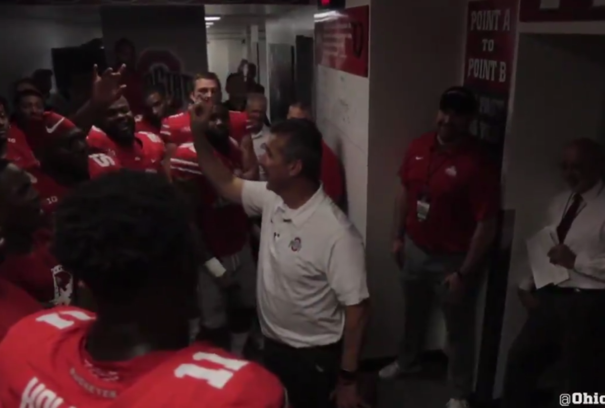 Urban Meyer gives game ball to J.T. Barrett.