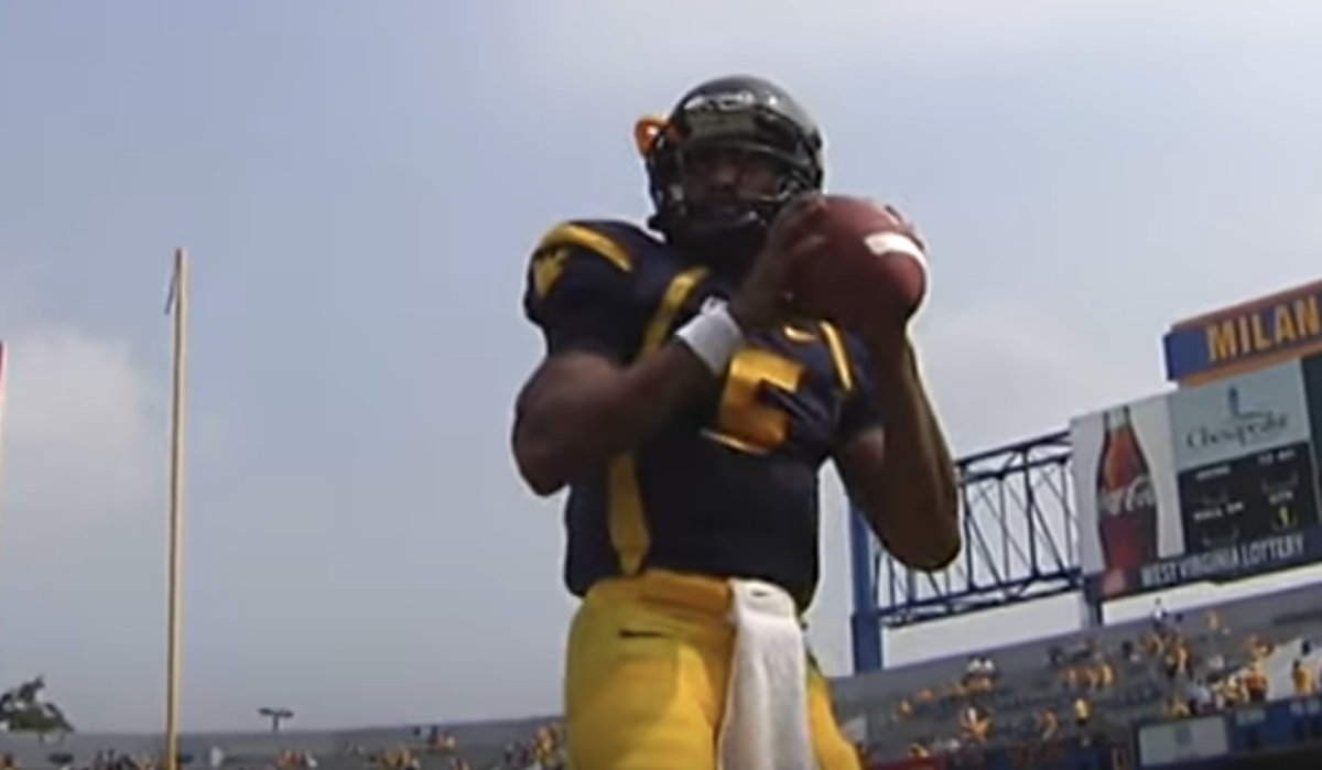Pat White warms up before a West Virginia game.