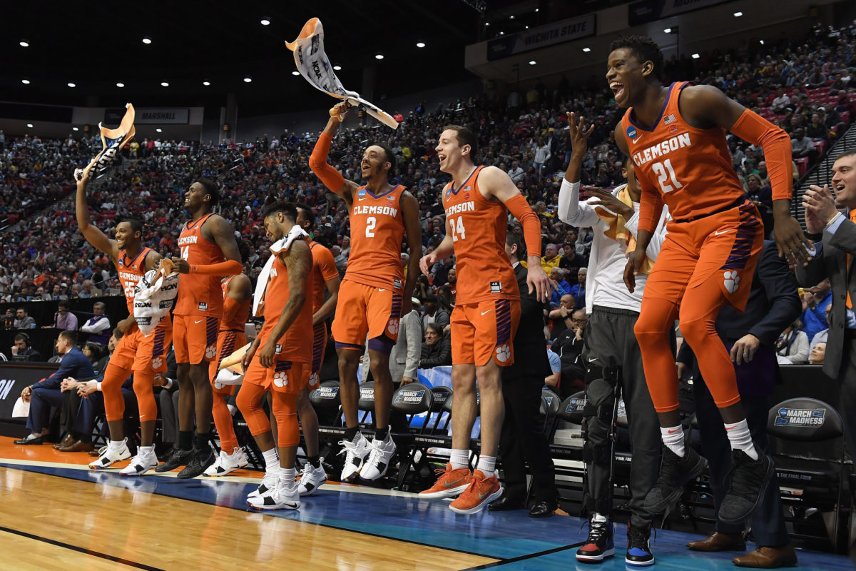 Clemson's players celebrate during a basketball game.