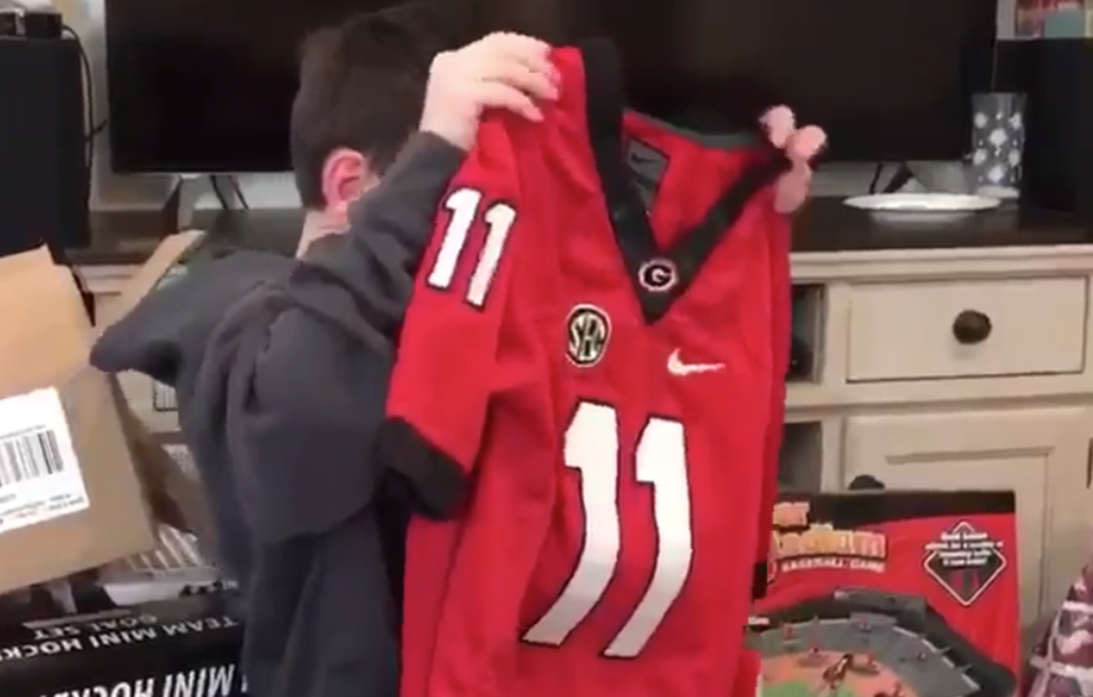 Kid receives Jake Fromm jersey for Christmas.