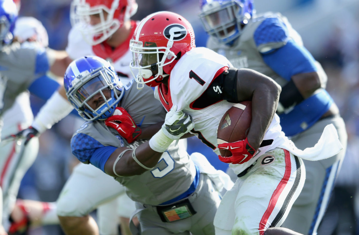 Sony Michel shedding a Kentucky player's tackle.