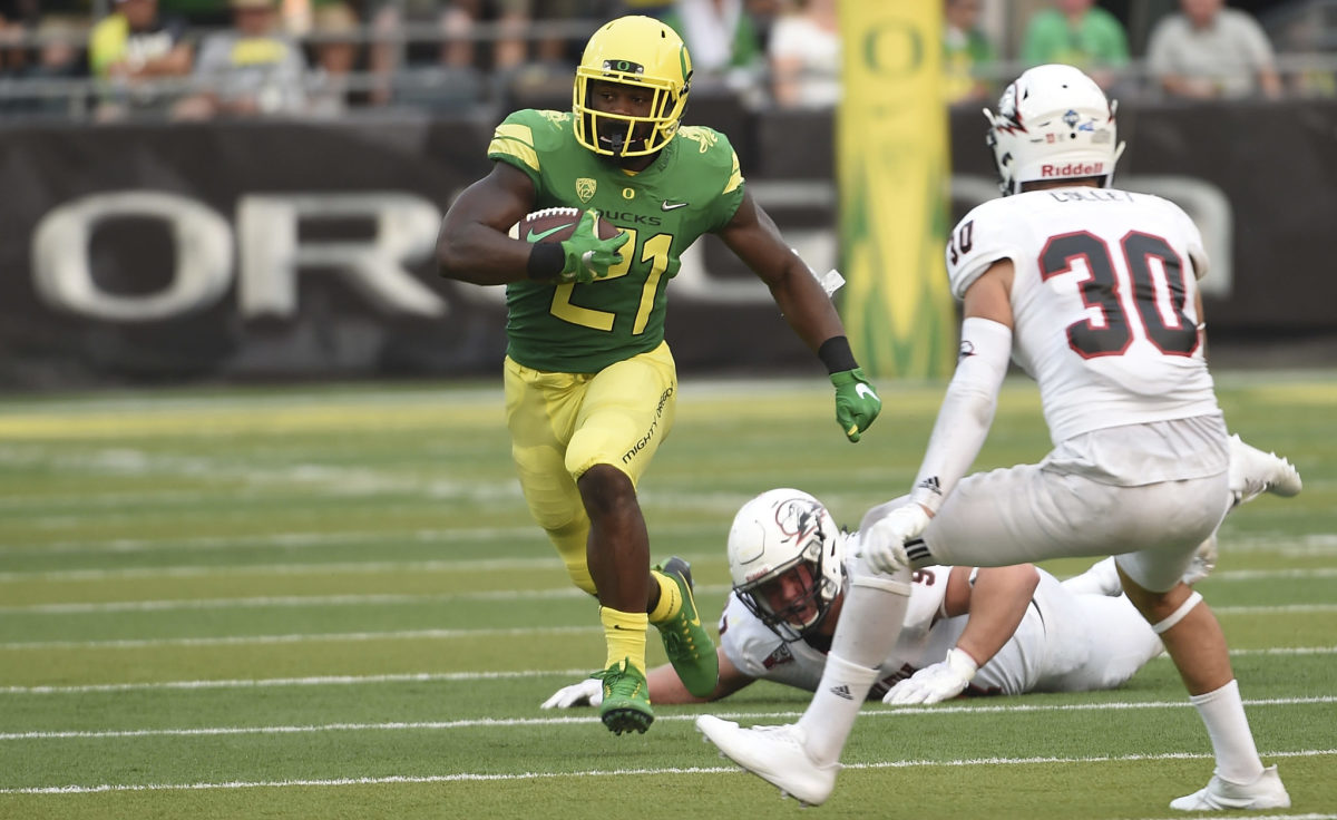 Royce Freeman looks for an opening on the field.