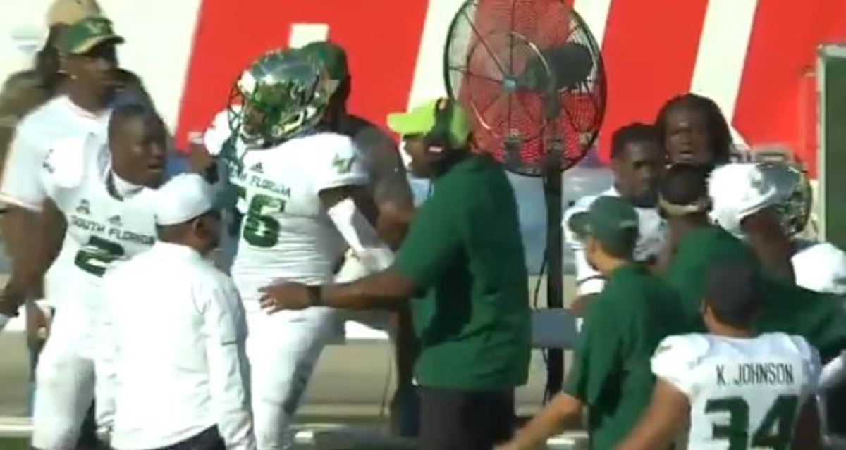 USF football's Khalid McGee and coach Blue Adams are separated.