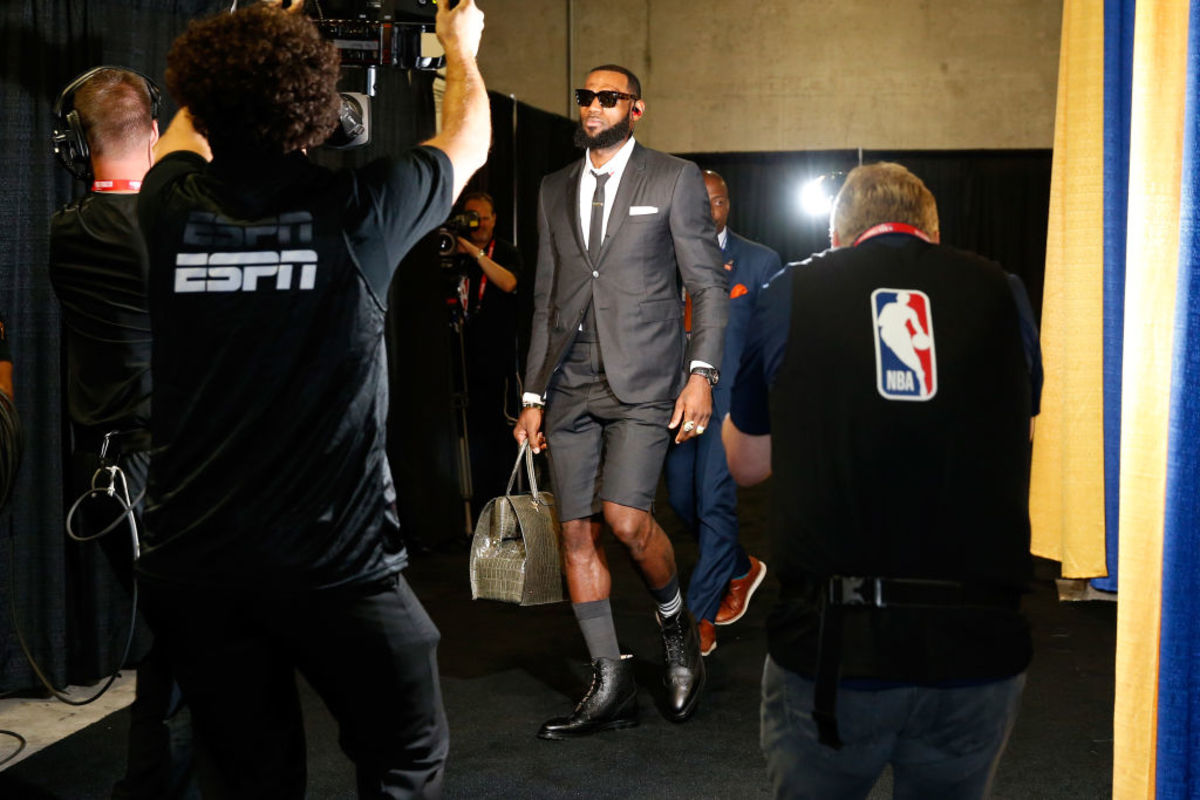 LeBron James arrives at a game wearing shorts.