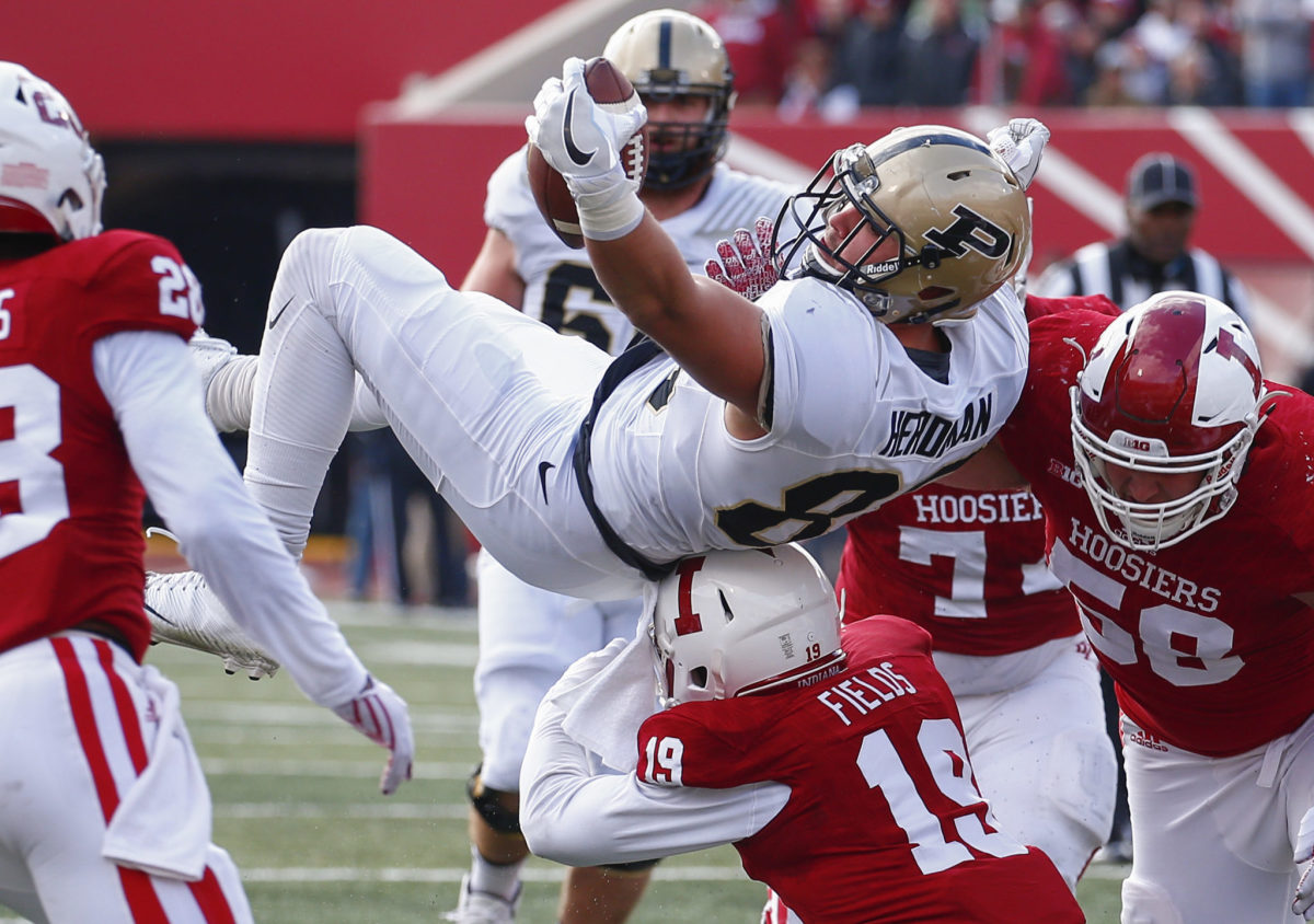 Cole Herdman #88 of the Purdue Boilermakers is tackled by Tony Fields #19 of the Indiana Hoosiers at Memorial Stadium.