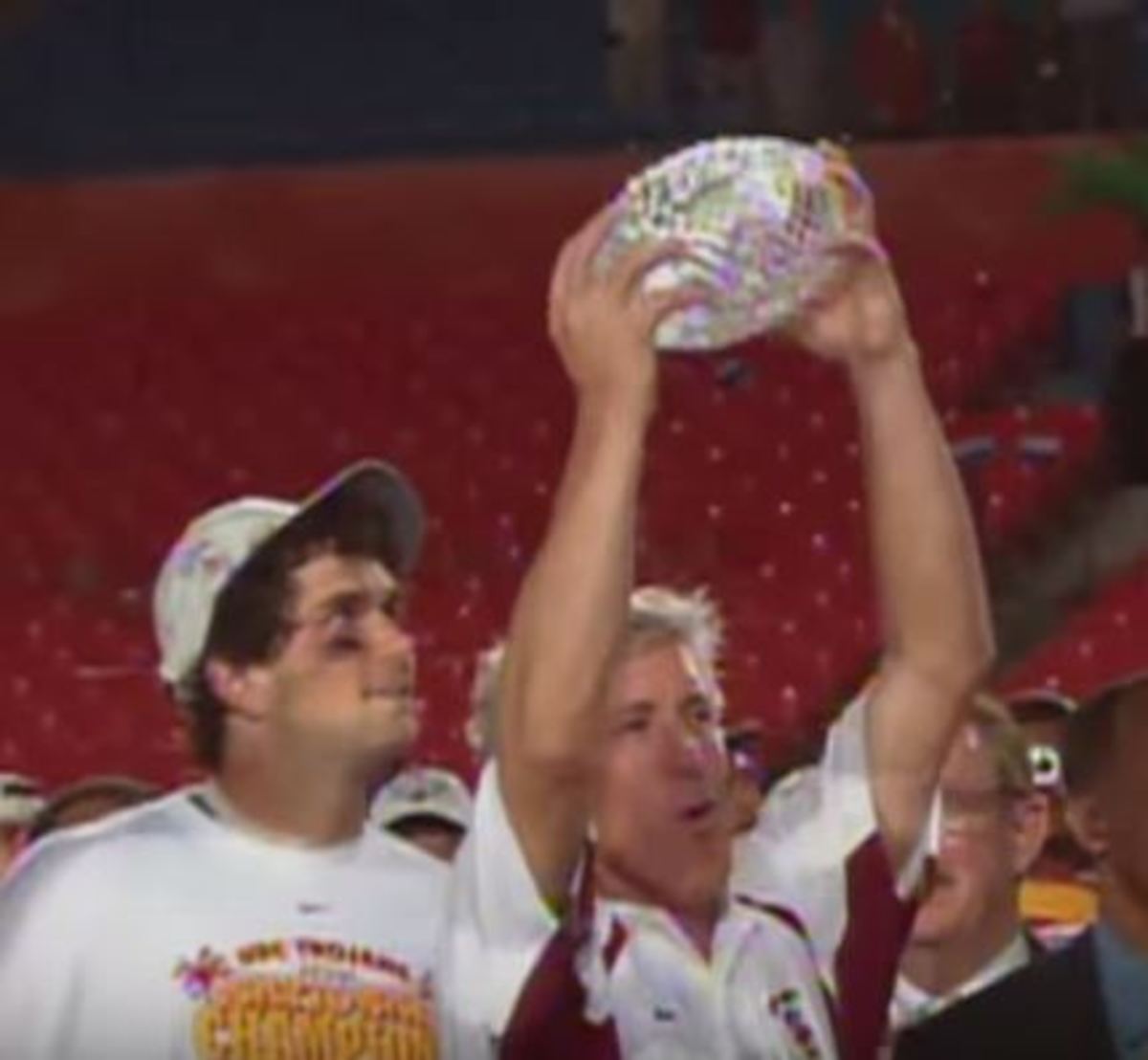 Pete Carrol seen holding the National Championship trophy.