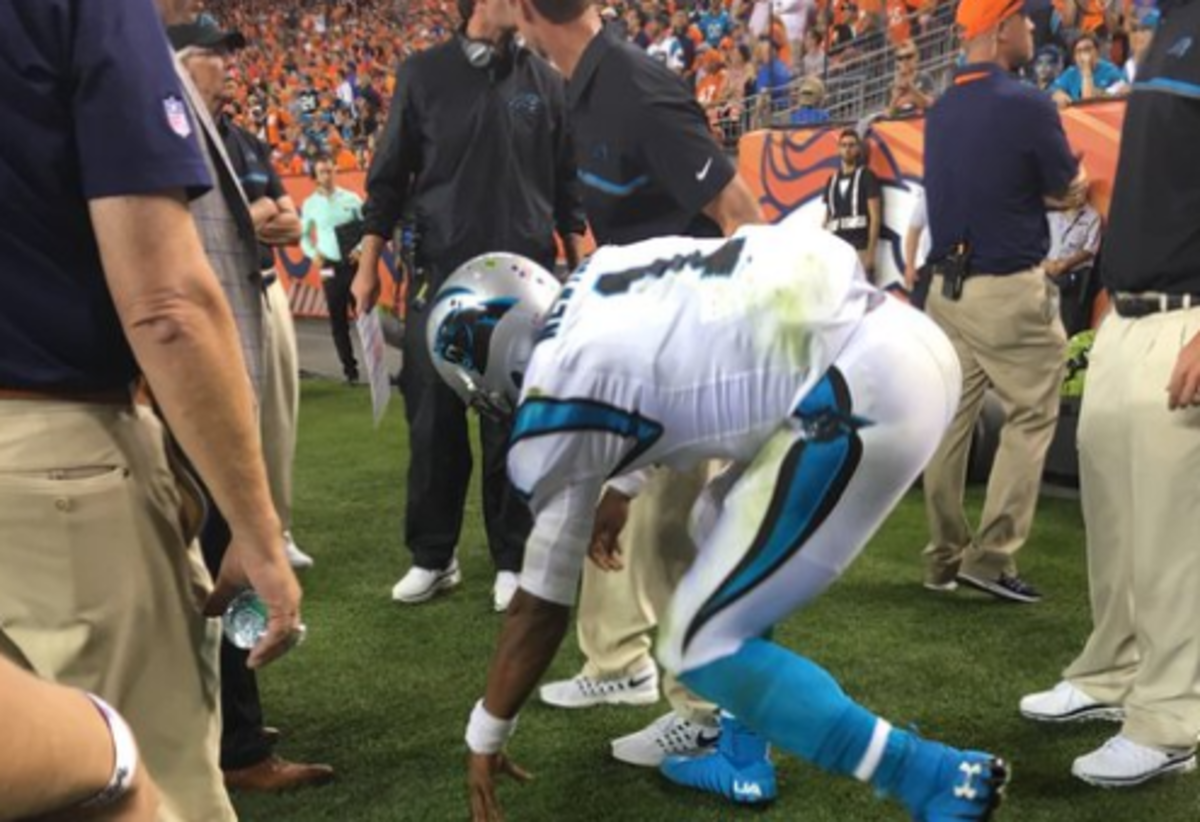 Cam Newton going to the ground after suffering an injury