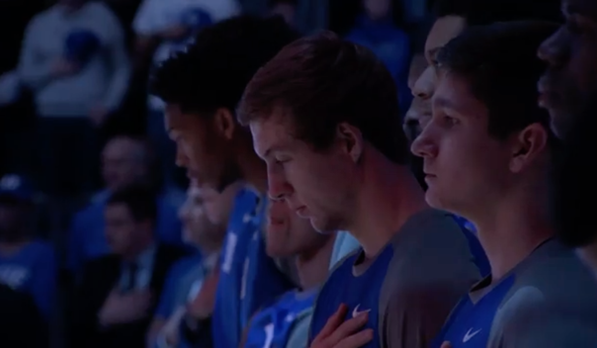 Duke basketball players lined up for the National Anthem.