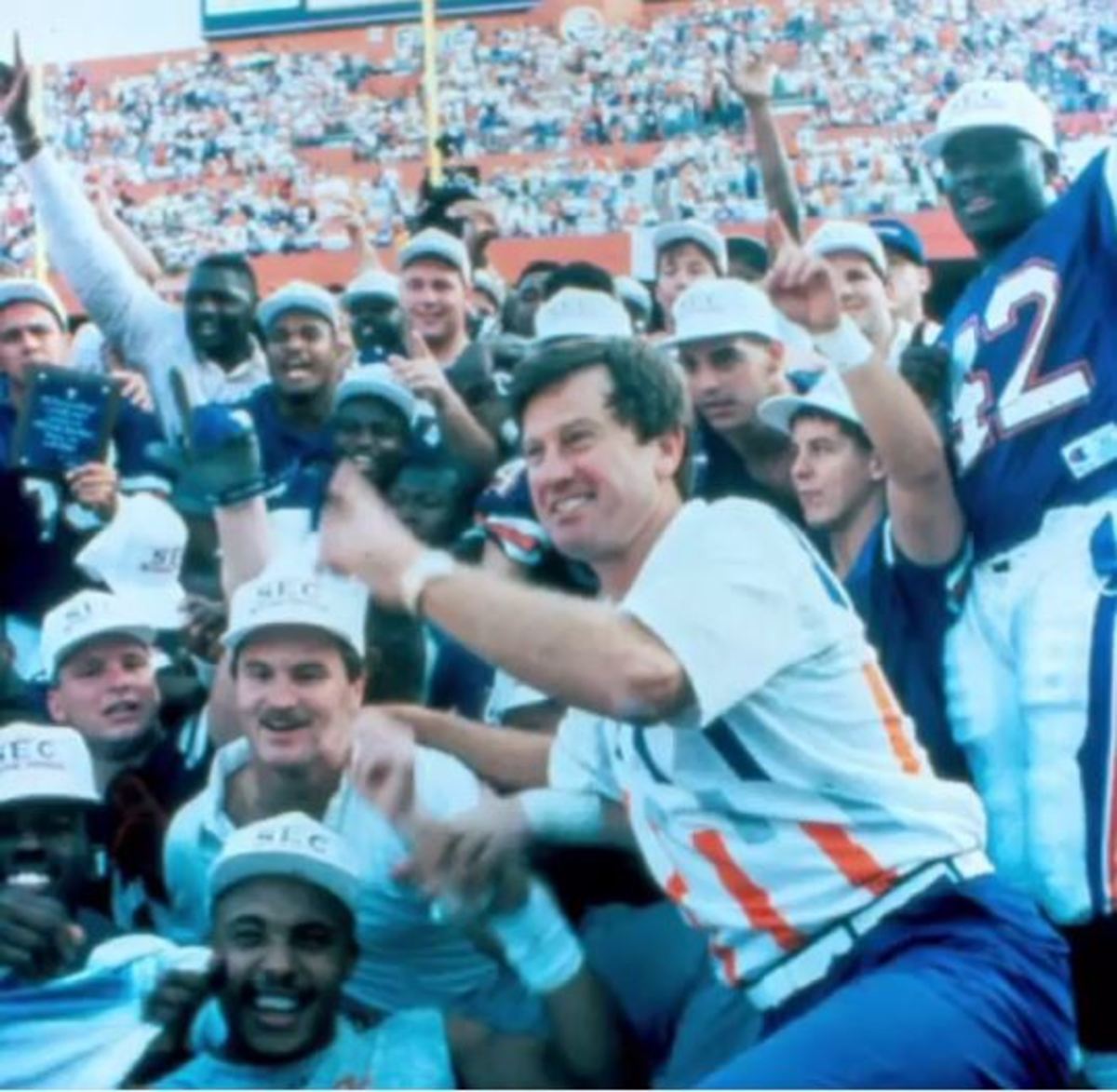 Steve Spurrier posses for a throw back picture with the Gators.