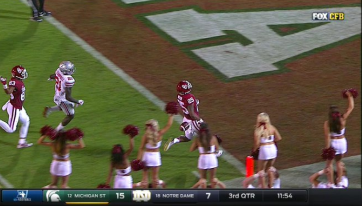 Joe Mixon dropping the ball just before crossing the goal line.
