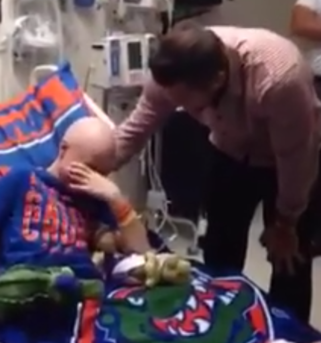 Tim Tebow with a young Gator fan at the hospital.