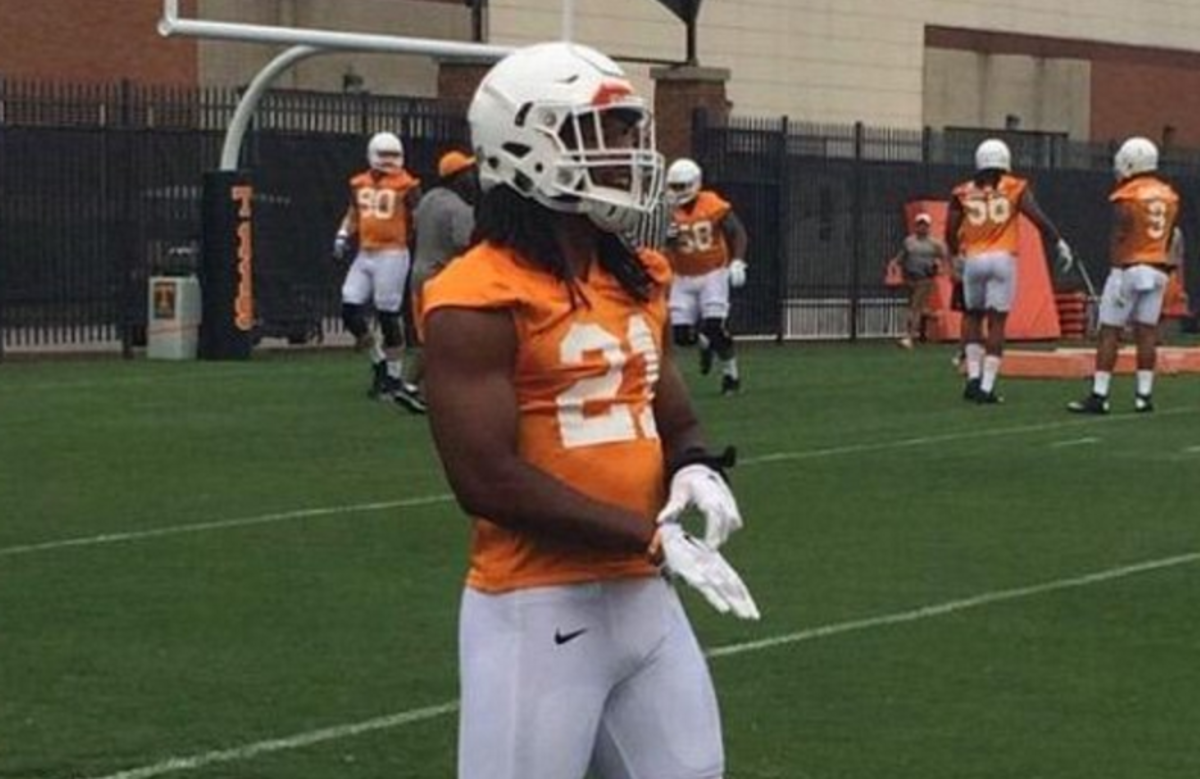Tennessee football player Jalen Reeves wearing white gloves at practice.