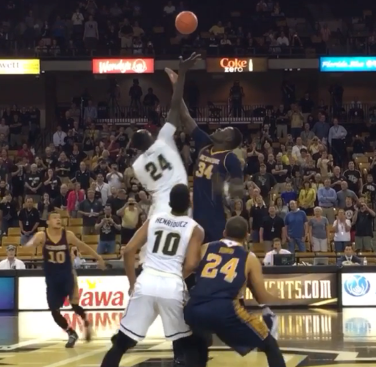 UCF and UC-Irvine's 7 foot 6 centers jump for the opening tip.