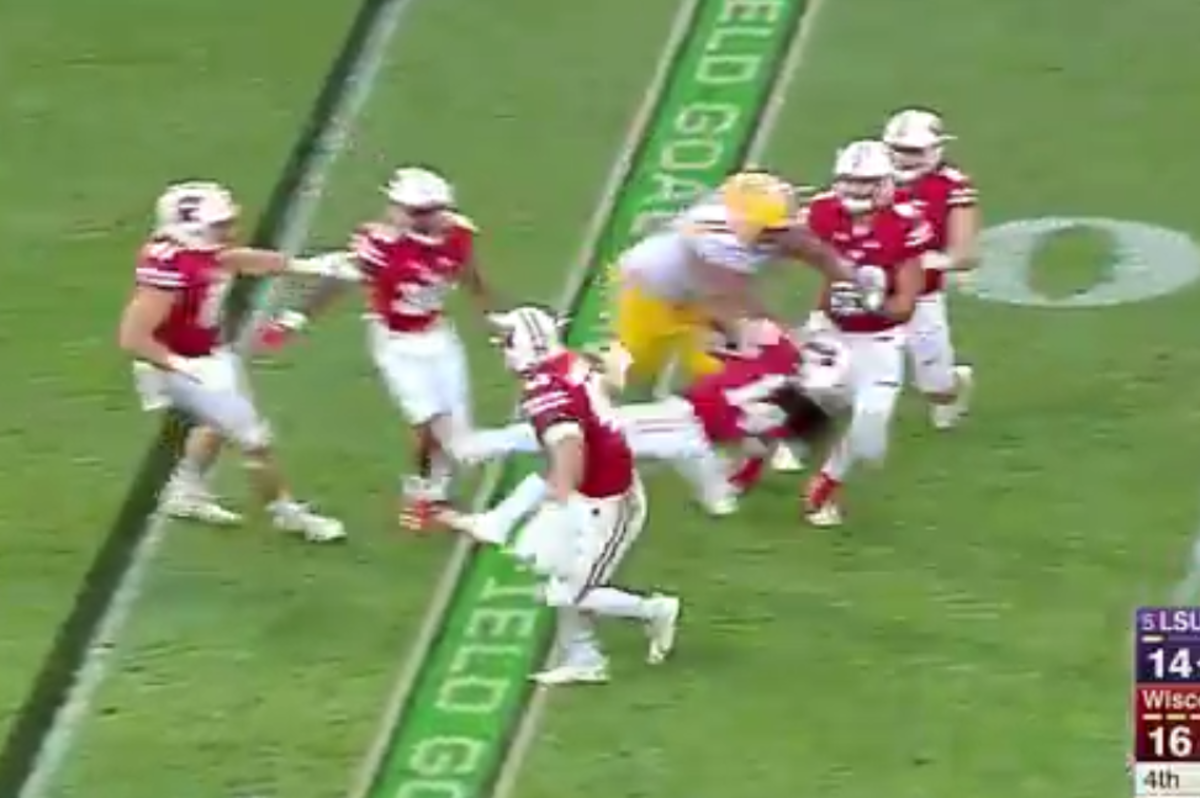 LSU player taking a cheap shot at a Wisconsin player.