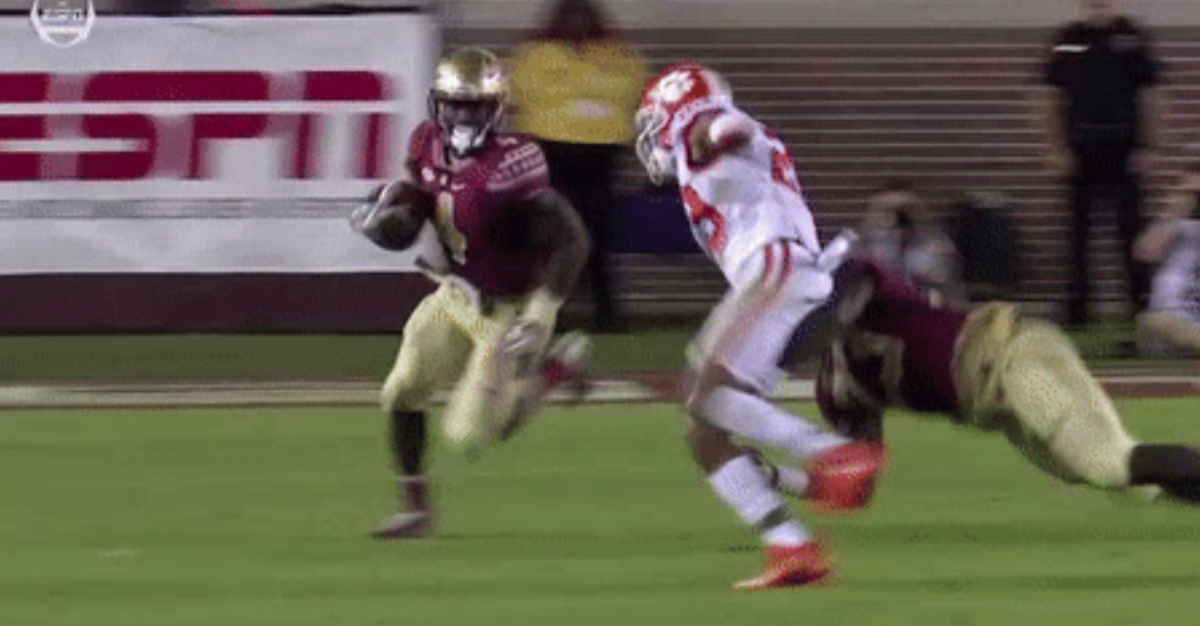 A picture of a Florida State player laying a block for running back Dalvin Cook.