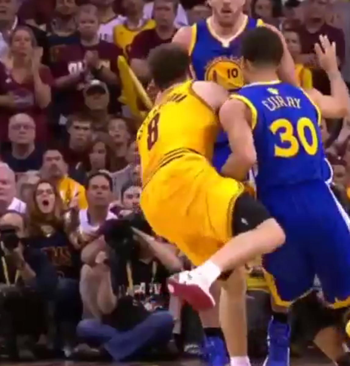 Dellavedova and Curry get tangled in playoff game.