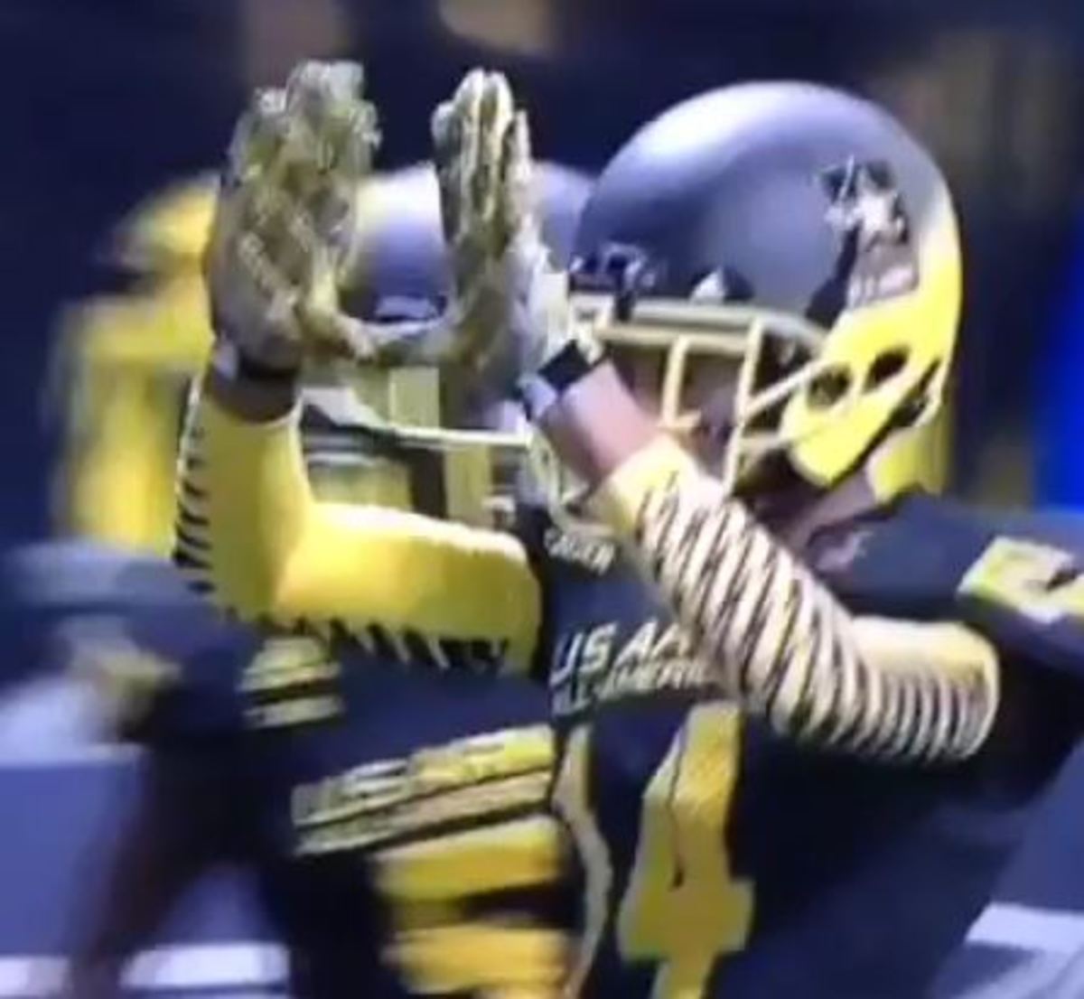 Lawrence Cager throws up "The U" after Army All-American Game touchdown.
