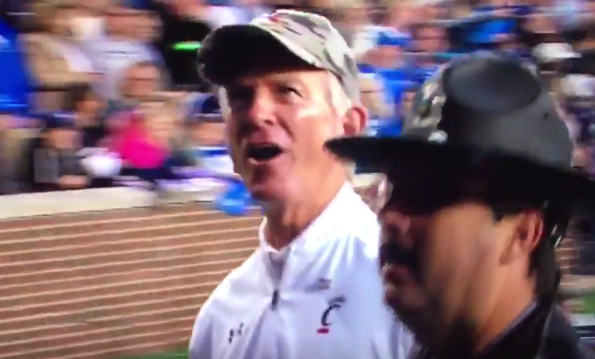 Tommy Tuberville yells at a fan during a Cincinnati game.