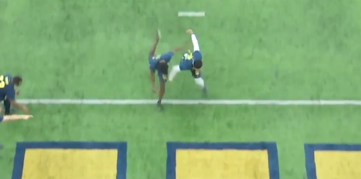 Michigan Football's David Long sprints in a footrace.