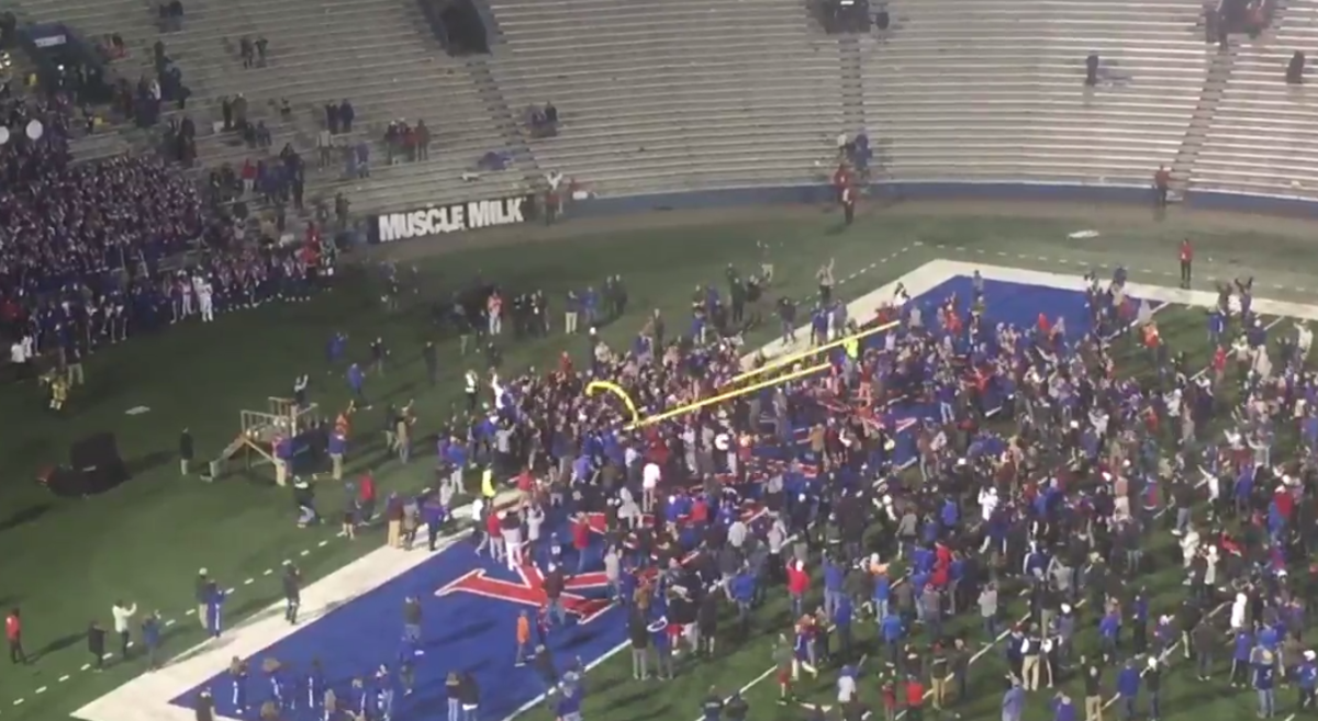 Kansas fans tore down the goal post after their win over Texas.
