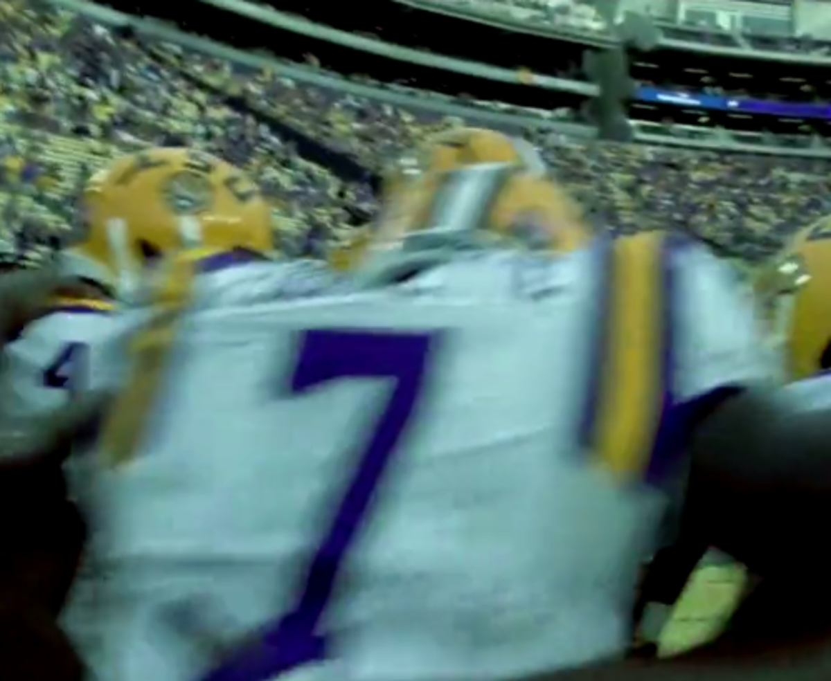 LSU players running out onto the field for game day.