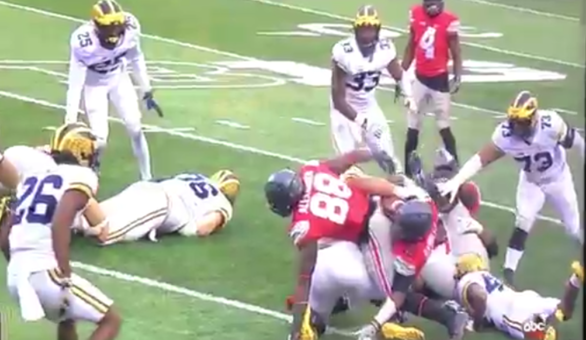 J.T. Barrett gets a controversial first down against Michigan.