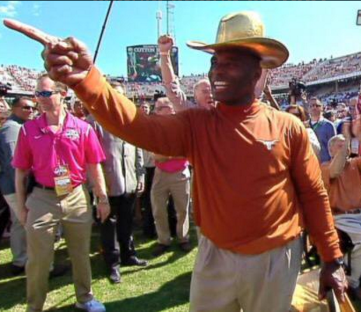 Charlie Strong dons a cowboy hat.