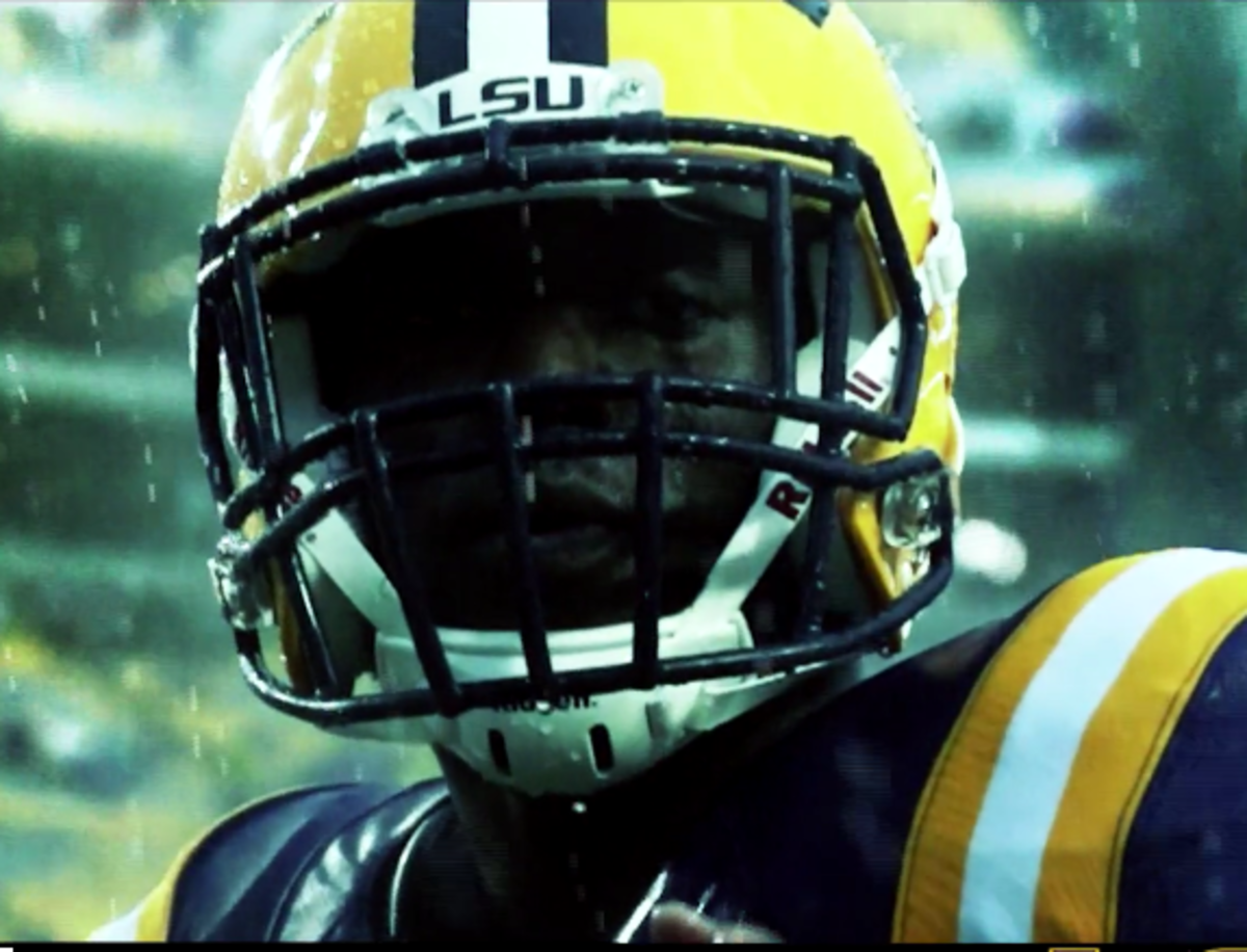 LSU player close up with rain pouring down.