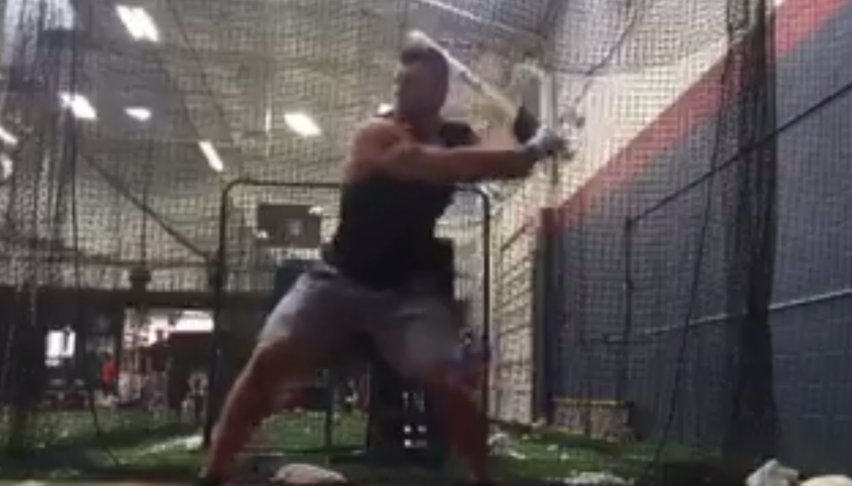 Tim Tebow in a batting cage.
