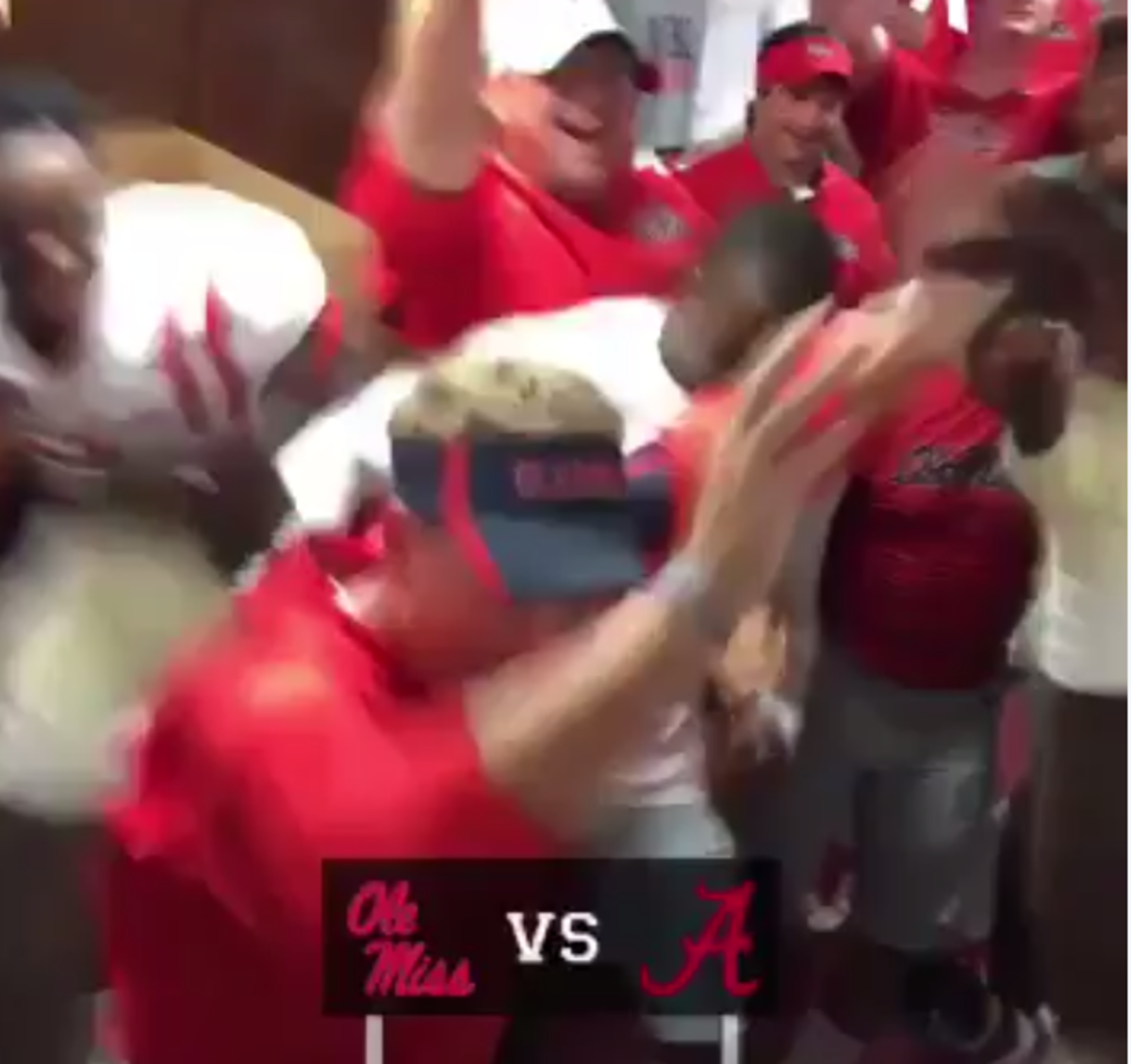 Hugh Freeze dances in the locker room after Ole Miss's win against Alabama.