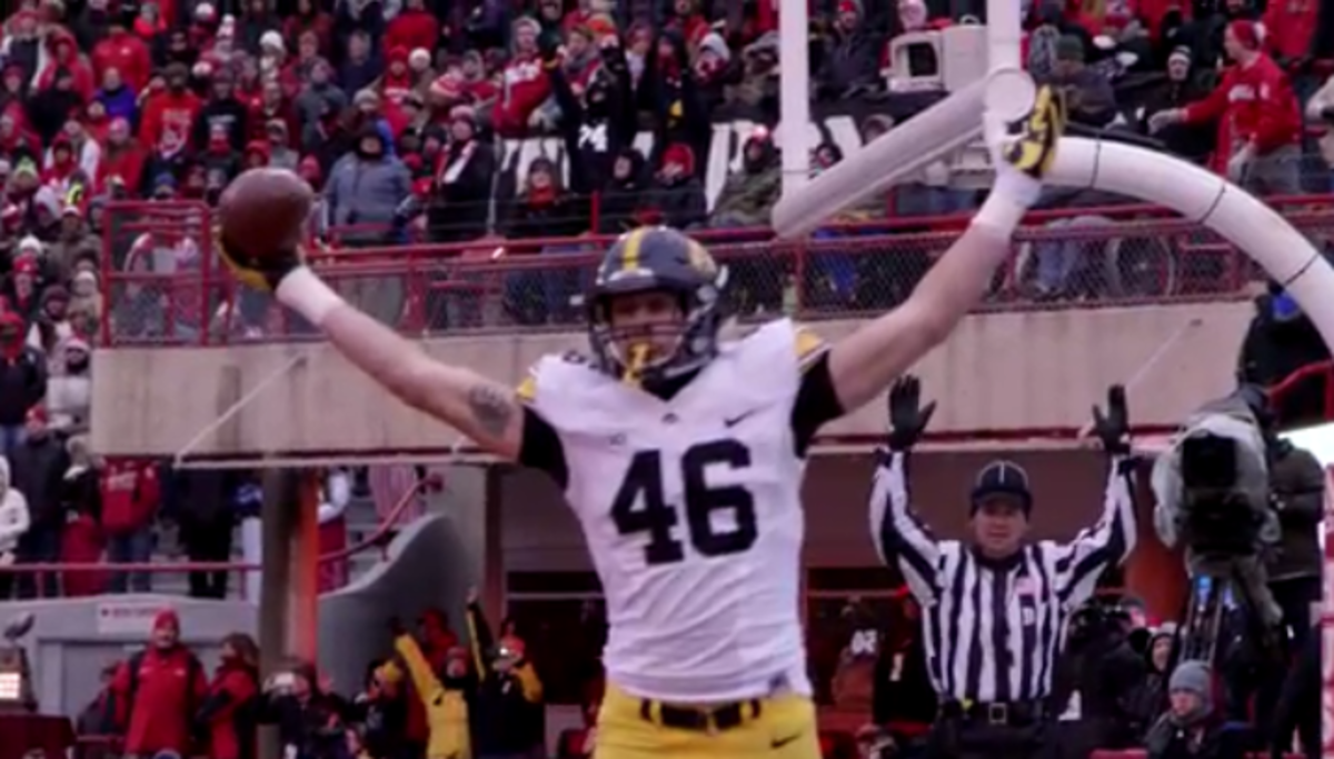 An Iowa player celebrates after scoring a touchdown.