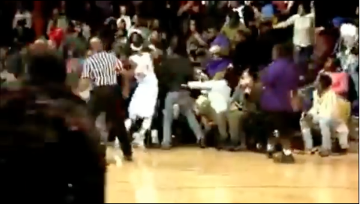 A brawl erupts in a Division II basketball game.