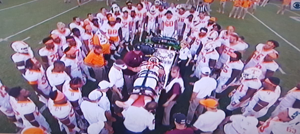 Danny O'Brien being carted off the field after an injury.