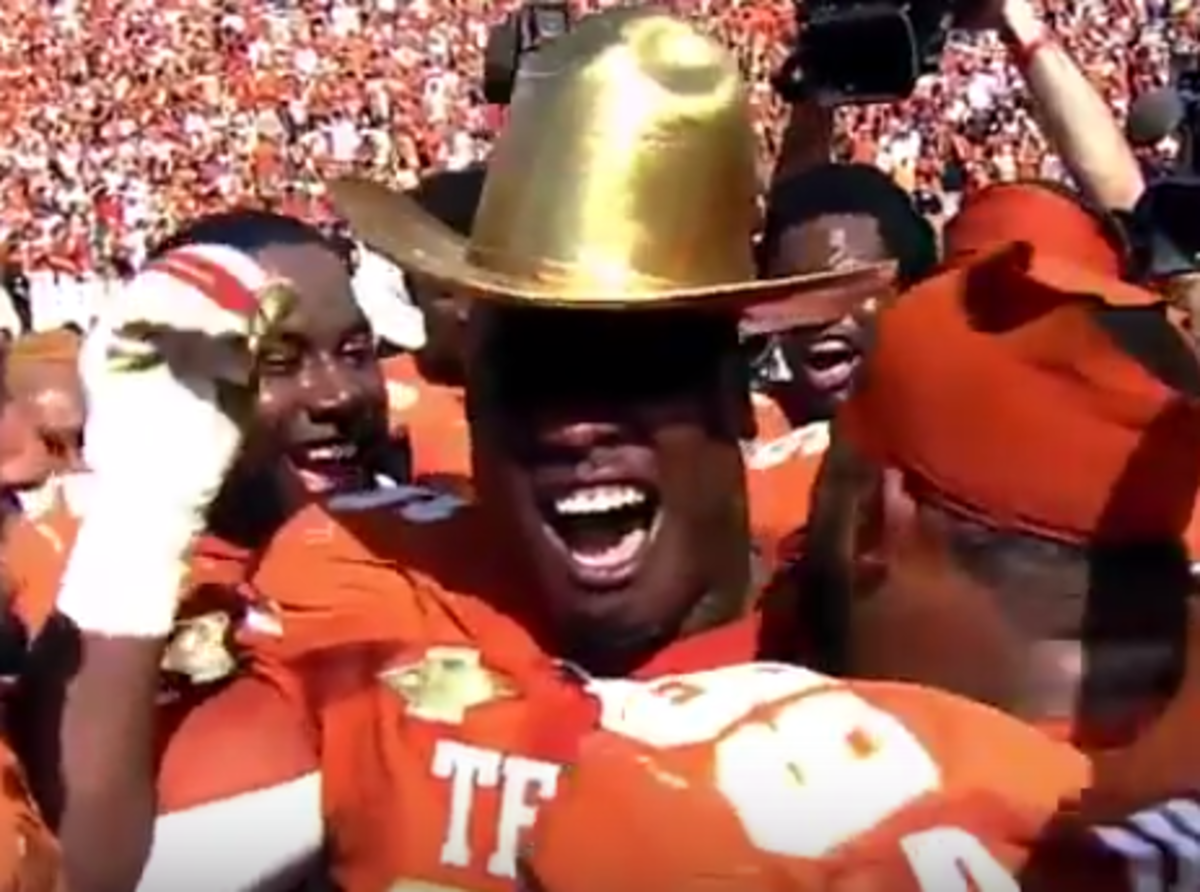 Texas players celebrate winning the Red River Rivalry.