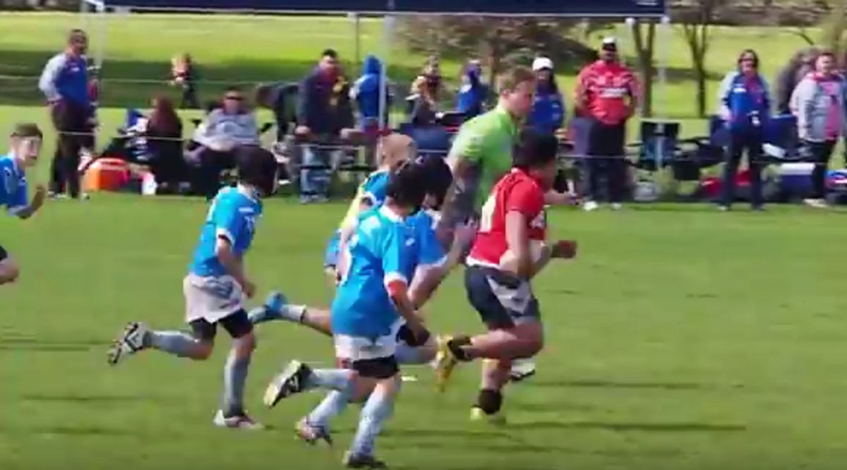 A photo of a 9-year-old rugby player dominating the competition.