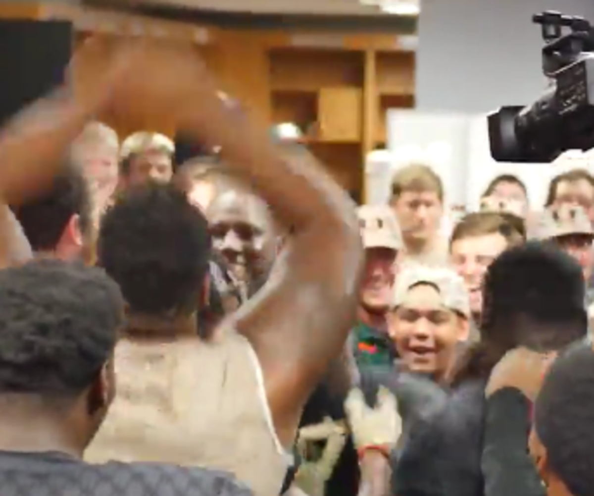 Miami players dance in the locker room after beating Virginia.