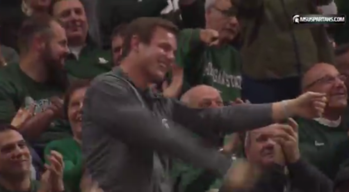Michael Geiger of Michigan State does his windmill celebration at basketball game.