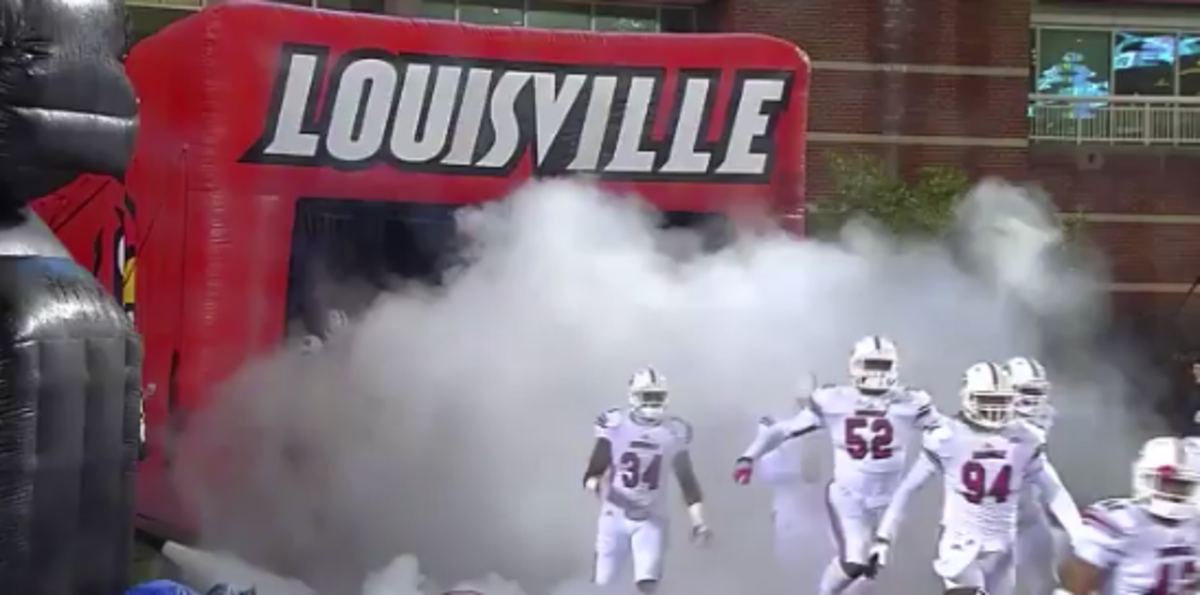Louisville players running onto the field
