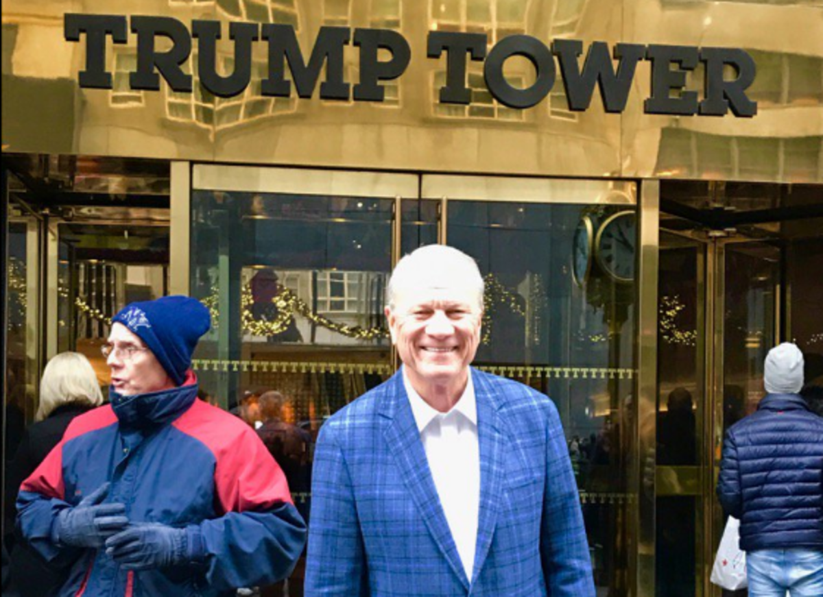 Barry Switzer poses in front of the Trump Tower.